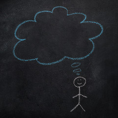Fototapeta na wymiar Symbol of human with empty blue cloud, speech bubble drawn with chalk on blackboard