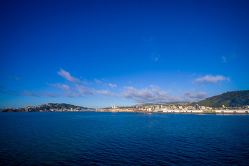 Beautiful view of the city in the horizont from ferry between north and south island in New Zealand, sailing into Picton