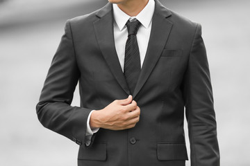 Closeup of man wearing suit and tie. 