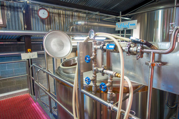 SOUTH ISLAND, NEW ZEALAND- MAY 25, 2017: Modern beer plant brewery , with brewing kettles, vessels, tubs and pipes made of stainless steel, monteiths beer factory, south island in New Zealand