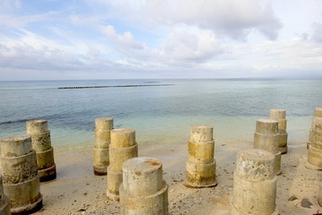 Naklejka premium Wave breaker made of concrete protecting the coast from erosion at Gili Trawangan Lombok Indonesia