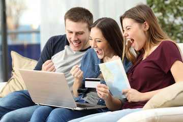 Excited friends buying trip on line