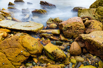 Colourful rocks and water at Diamond Head coast, Australia
