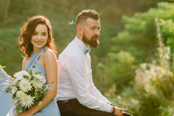 Sad bearded guy with his girlfriend at the wedding