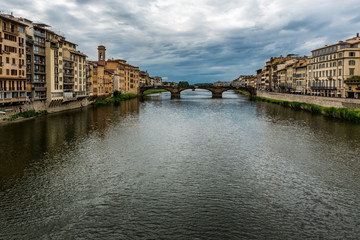 Naklejka premium Florence or Firenze city view on Arno river, Tuscany, Italy. Shot from Ponte Vecchio
