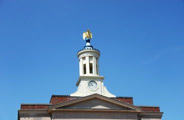 Fototapeta na wymiar closeup on golden eagle statue on city hall tower of Nashua NH