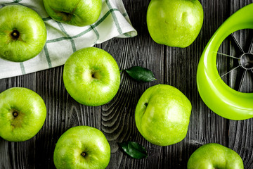 summer food with green apples on dark background top view pattern