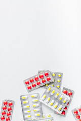 doctor's work with pills on hospital desk background top view mock up