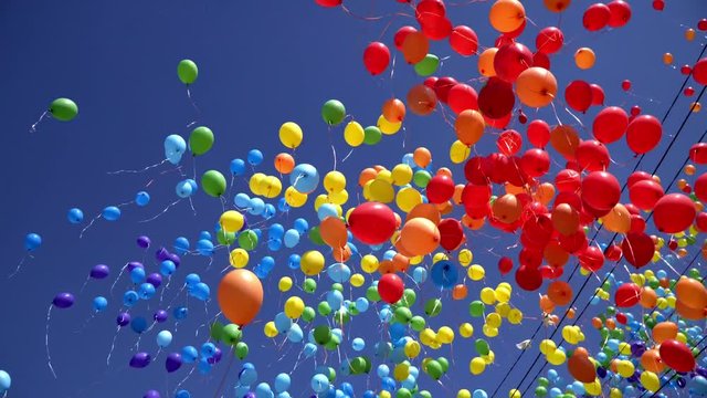 a lot of balloons in the sky