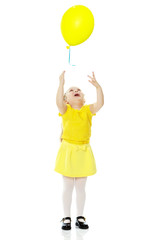 Little girl with balloons.