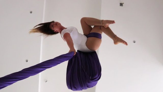Woman dancer on aerial silk