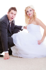 Happy groom and bride posing for marriage photo