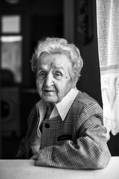 Black and white contrast portrait of an elderly woman.
