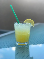 Summertime lemonade with a slice of lemon. 