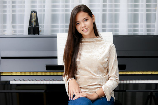 Asian Girl And Piano