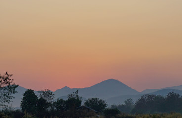 Beautiful sunset at the mountains. Colorful landscape with sun
