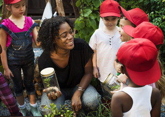 Teacher and kids school learning ecology gardening