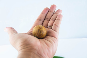  fruit or literally translated as Cat Eye Fruit , a subspecies of the Longan Fruit over white...