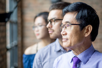 Serious Diverse Business Team Standing in Row