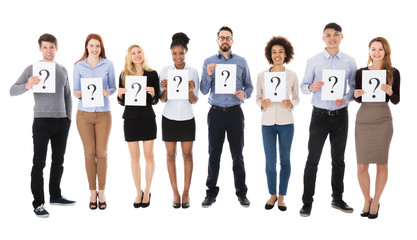 Group Of College Students With Question Mark Sign