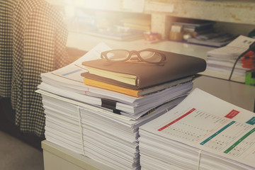 Pile of unfinished documents on office desk, Stack of business paper, Vintage Effect