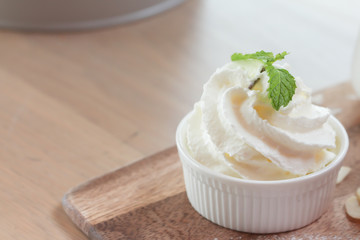 Whipped cream in ceramic cup 