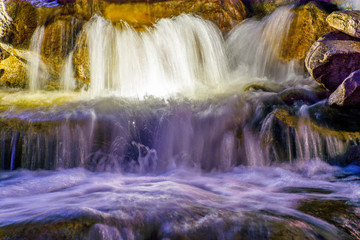 Fototapeta premium Waterfall with light in the night