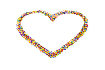 Heart made of colored confetti. Small circles of colored paper. White background. View from above. Colored heart.