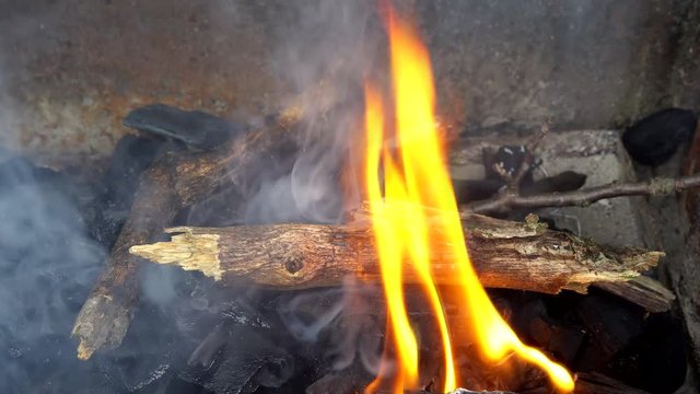 fire wood for barbecue charcoal Slow Motion Closeup of a warm fire burning in a campfire
