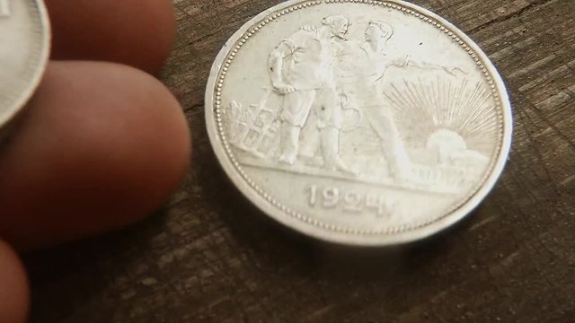 Different Old Soviet Silver Coins Fingers Put in Turn on Wooden Surface Macro