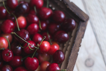 Cherry berries are fresh on a wooden background. Concept of health.