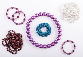 Women's beaded necklace from round colorful pearl beads isolated on white background. Female accessories.