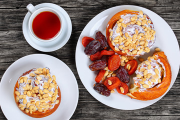 baked homemade cinnamon rolls topped with peanuts