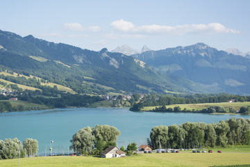 Fototapeta premium A View of Lac de la Gruyère (Lake of Gruyère) in Switzerland on a Summer Day