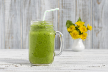 Smoothies from dill, celery and banana, close up