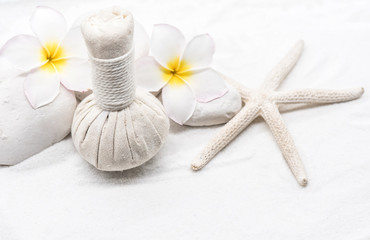 Fototapeta na wymiar Spa and massage decoration on white sand