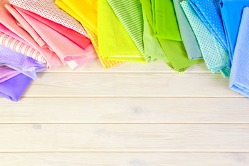 Accessories for sewing lie on a white background. Measuring tape, thread, fabric, needle bar and...