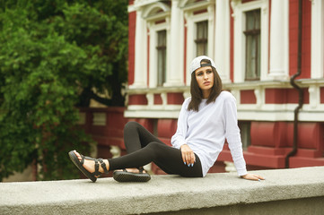 Fashion model on the street. Beautiful young woman in stylish summer clothes