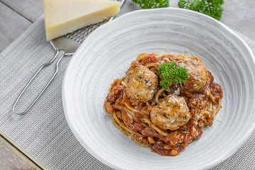 Spaghetti with Meatballs and tomato sauce and Parmesan cheese