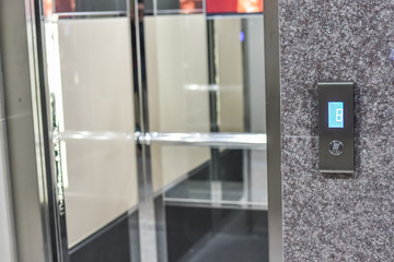 Elevator interior with modern design and pressing elevator buttons