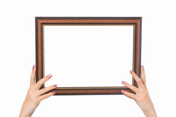 Frame in female hands on a white background