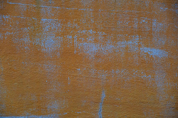 The paint is peeling off, falling apart wall