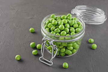 Healthy food. Fresh green peas in open glass jar