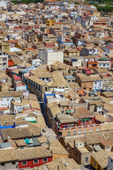 Fototapeta premium Top view of roofs in crowded city