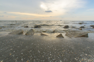 Scenery of sunset captured at Pantai Remis, Selangor, Malaysia. The motion of cloud and water is due to long exposure effect. Low light