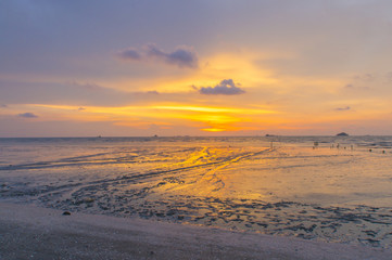 Scenery of sunset captured at Pantai Remis, Selangor, Malaysia. The motion of cloud and water is due to long exposure effect. Low light