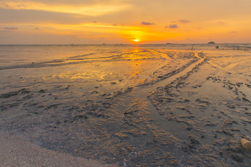 Scenery of sunset captured at Pantai Remis, Selangor, Malaysia. The motion of cloud and water is due to long exposure effect. Low light