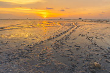 Scenery of sunset captured at Pantai Remis, Selangor, Malaysia. The motion of cloud and water is due to long exposure effect. Low light