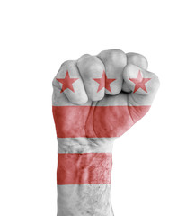 Flag of US District of Columbia state painted on human fist like victory symbol