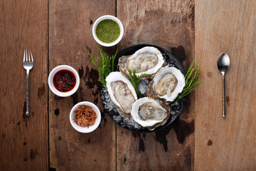 Fresh Oyster with side dish,Ready to eat. On The Table